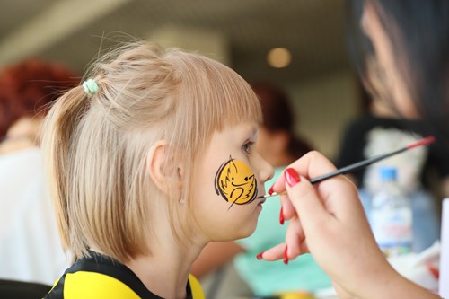 A young Rostov fan has her face painted with the team's logo